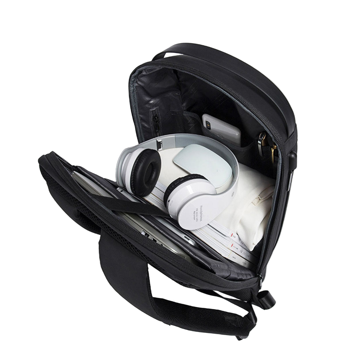 Black backpack with compartments containing electronic devices on a light gray background